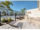 A patio view includes lounge chairs and a dining set, perfect for enjoying the outdoor space at 7925 Putting Green Way, Reunion, FL 34747
