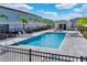 Relaxing pool area with clear blue water, lounge chairs, and a nearby cabana for shade at 7925 Putting Green Way, Reunion, FL 34747