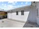 This backyard with an orderly design, showcasing access to storage and a concrete patio with backyard views at 814 S Lakeshore Blvd, Lake Wales, FL 33853