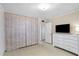 Bonus room has folding closet doors, a TV, and access to another room at 814 S Lakeshore Blvd, Lake Wales, FL 33853