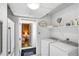 Bright laundry room with modern appliances and access to additional rooms at 814 S Lakeshore Blvd, Lake Wales, FL 33853