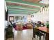 Bright living area featuring exposed beams, a comfortable seating area, and serene lake views at 814 S Lakeshore Blvd, Lake Wales, FL 33853