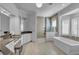 Spa-like bathroom with soaking tub and walk-in shower at 8148 Tibet Butler Dr, Windermere, FL 34786