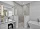 Spa-like bathroom featuring a large walk-in shower and free-standing tub at 8148 Tibet Butler Dr, Windermere, FL 34786
