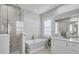 Elegant bathroom with soaking tub, walk-in shower, and modern vanity at 8148 Tibet Butler Dr, Windermere, FL 34786