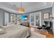 Primary bedroom with French doors opening to backyard at 8148 Tibet Butler Dr, Windermere, FL 34786