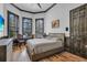 Spacious bedroom with wood floors, large windows and comfy seating area at 8148 Tibet Butler Dr, Windermere, FL 34786