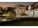 Elegant two-story home with a manicured lawn and a three-car garage at 8148 Tibet Butler Dr, Windermere, FL 34786