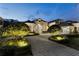 Stunning home with a brick paver driveway and beautifully lit landscaping at 8148 Tibet Butler Dr, Windermere, FL 34786