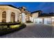 Lovely home with a large driveway and modern glass garage doors at 8148 Tibet Butler Dr, Windermere, FL 34786