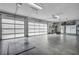 Large garage with ample storage space and epoxy flooring at 8148 Tibet Butler Dr, Windermere, FL 34786