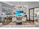 Comfortable Gathering room with a large TV, built-in shelving and comfortable seating at 8148 Tibet Butler Dr, Windermere, FL 34786