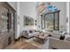 Elegant living room featuring hardwood floors, comfortable seating and large windows at 8148 Tibet Butler Dr, Windermere, FL 34786