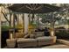 Peaceful patio with covered seating and tranquil sunset views at 8148 Tibet Butler Dr, Windermere, FL 34786