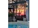 Inviting pool area with stunning sunset reflection at 8148 Tibet Butler Dr, Windermere, FL 34786