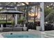 Relaxing pool and spa with covered lanai, offering sunset views at 8148 Tibet Butler Dr, Windermere, FL 34786