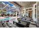 Inviting pool area with a covered patio and comfortable seating at 8148 Tibet Butler Dr, Windermere, FL 34786