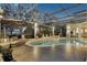 Tranquil pool and spa with covered lanai and night lighting at 8148 Tibet Butler Dr, Windermere, FL 34786