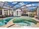 Stunning pool and spa with covered patio and outdoor seating at 8148 Tibet Butler Dr, Windermere, FL 34786