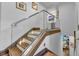 Modern glass and wood staircase with ambient lighting at 8148 Tibet Butler Dr, Windermere, FL 34786