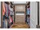 Large walk-in closet with ample shelving and hanging space at 8148 Tibet Butler Dr, Windermere, FL 34786