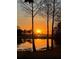 Scenic sunset view over peaceful lake and golf course at 8148 Tibet Butler Dr, Windermere, FL 34786