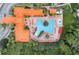 Aerial view of a resort-style pool and lounge area surrounded by lush landscaping at 8189 Roseville Rd, Davenport, FL 33896