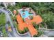 Aerial view of a community pool and clubhouse, offering a luxurious living experience at 8189 Roseville Rd, Davenport, FL 33896