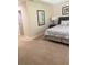 Neutral-toned bedroom featuring a comfortable bed and neutral walls at 8189 Roseville Rd, Davenport, FL 33896