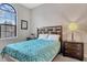 Bright bedroom with a large arched window, providing ample natural light at 8189 Roseville Rd, Davenport, FL 33896