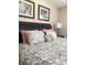 Bedroom features a comfortable bed with decorative pillows and two pictures on the wall at 8189 Roseville Rd, Davenport, FL 33896
