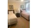 Cozy bedroom with twin beds, nightstand, and window with blinds at 8189 Roseville Rd, Davenport, FL 33896