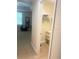 Bedroom view towards the closet, window, chair, and neutral color theme at 8189 Roseville Rd, Davenport, FL 33896