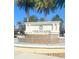 Community fountain with decorative tile and surrounded by lush greenery and palm trees at 8189 Roseville Rd, Davenport, FL 33896