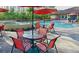 Outdoor seating area with pool views providing a perfect spot for relaxation and socialization at 8189 Roseville Rd, Davenport, FL 33896