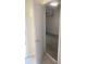 Spacious one car garage with white walls and partially open garage door at 8189 Roseville Rd, Davenport, FL 33896