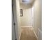 Hallway with carpet and neutral paint at 8189 Roseville Rd, Davenport, FL 33896