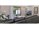 Bright living room featuring sliding glass doors to an outdoor patio and a comfortable sectional couch at 8189 Roseville Rd, Davenport, FL 33896