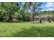 Community playground with a picnic shelter, tables, and green space for outdoor activities at 8189 Roseville Rd, Davenport, FL 33896
