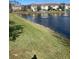 Serene pond view with water fountain and green space at 8189 Roseville Rd, Davenport, FL 33896