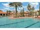 Gorgeous pool with plenty of lounge chairs and lush tropical landscaping at 8189 Roseville Rd, Davenport, FL 33896