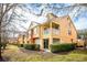 Two-story townhome with balcony and landscaped yard at 871 Assembly Ct, Reunion, FL 34747