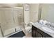 Bathroom with granite countertop, single vanity, and large walk-in shower at 8896 Bengal Ct, Kissimmee, FL 34747