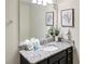 Bathroom with single vanity, granite countertop, and large mirror at 8896 Bengal Ct, Kissimmee, FL 34747