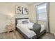 Cozy bedroom with a double bed, nightstand, and decorative wall art at 8896 Bengal Ct, Kissimmee, FL 34747