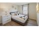Bedroom with gray bed, white dresser, and decorative wall art at 8896 Bengal Ct, Kissimmee, FL 34747