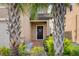 Welcoming house entrance with brick pathway and lush landscaping at 8896 Bengal Ct, Kissimmee, FL 34747