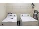 Laundry room with side-by-side washer and dryer, and shelving at 8896 Bengal Ct, Kissimmee, FL 34747