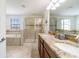 Double vanity bathroom with a walk-in shower and tub at 9024 Shadow Mountain St, Davenport, FL 33896