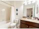 Clean bathroom with granite vanity and bathtub at 9024 Shadow Mountain St, Davenport, FL 33896